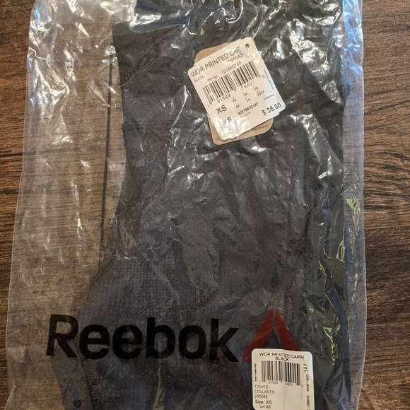 Reebok Pants - *never used* Reebok WOR Printed Capri. Black.